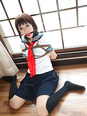 Dimdim Asian in school uniform is tied in ropes and can´t scream