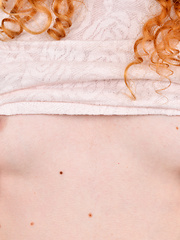 Pretty in pink, Candice Demellza runs her fingers through her wild hair and her hands across her small tit chest. She peels off her clothes slowly, en
