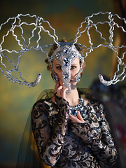 This flawless babe puts on a costume so she can express herself as she takes every part of it off.