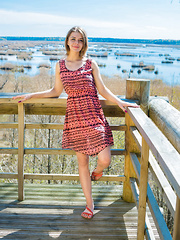 Yelena strips in the balcony as bares her beautiful, big tits.