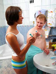 Teeth brushing teen cutie sucks his massive stiff boner