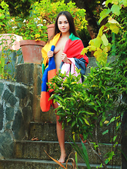 Li Moon flaunts her gorgeous body as she poses outdoors.